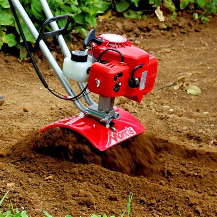 How do I check the oil in my Mantis tiller?
